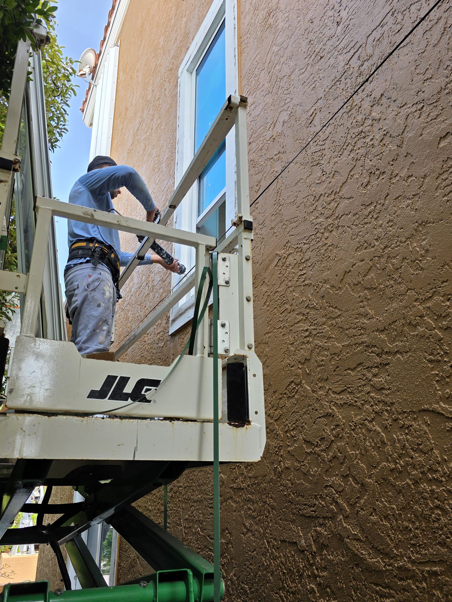 A&L crew installing windows from a lift
